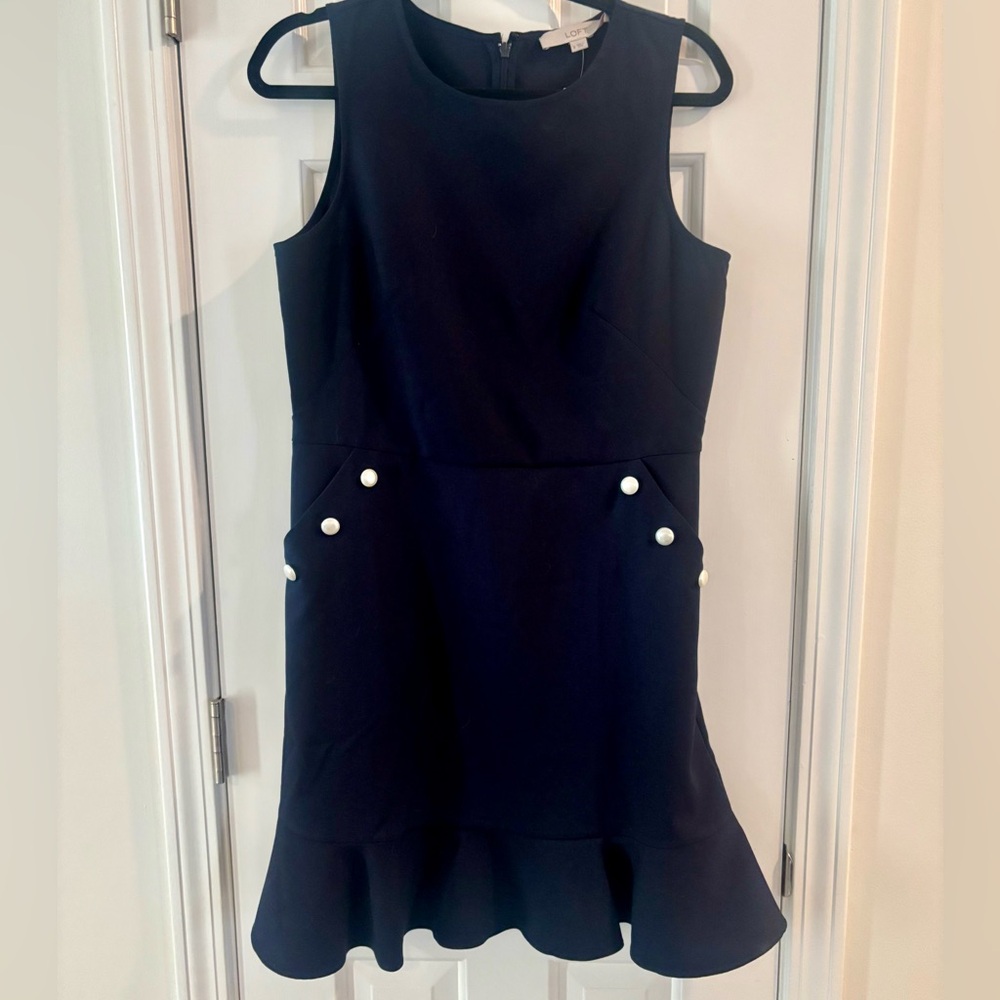 NWT Navy dress with pearl buttons, peplum skirt hem and pockets. Size 8.